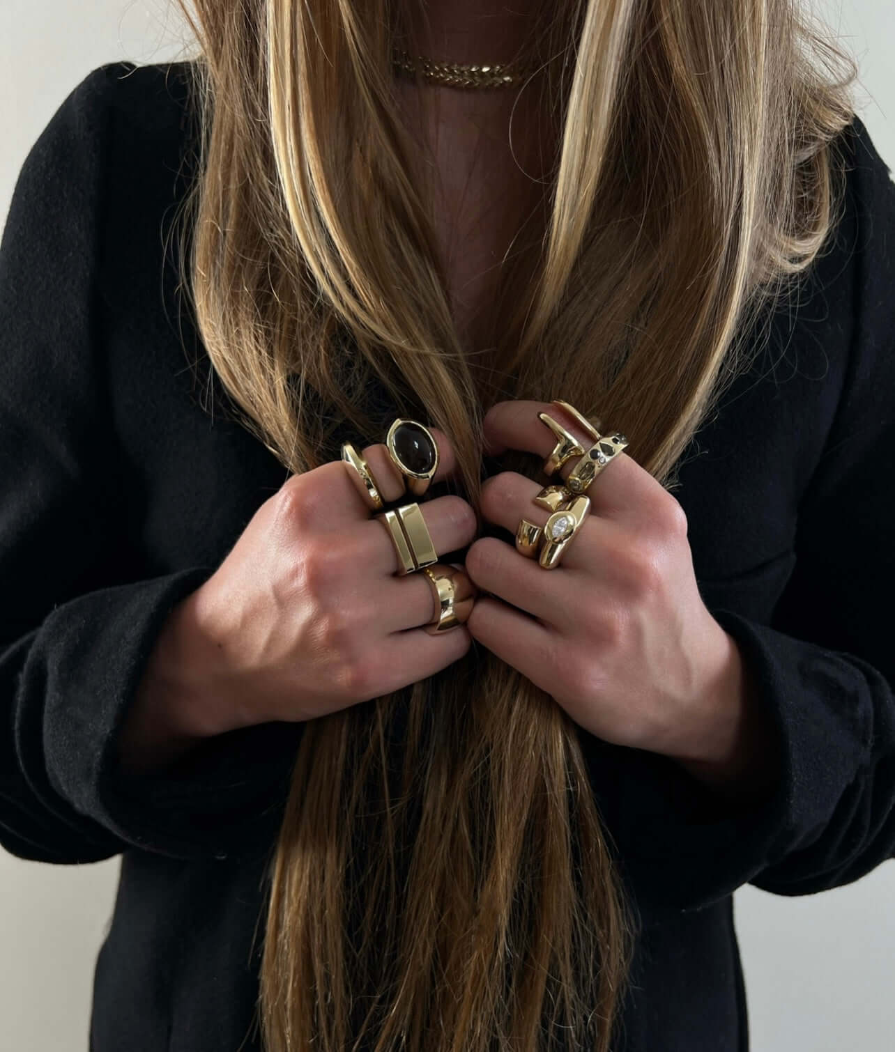 woman wearing gold rings