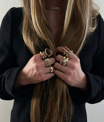 woman wearing gold rings