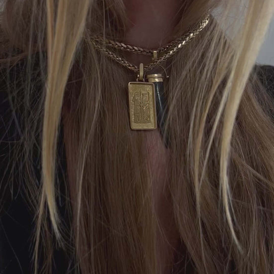 woman wearing moonstone agate charm pendant